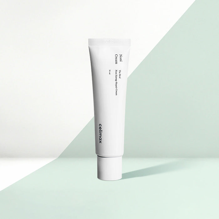 Celimax The Real Noni Energy Repair Creme in 50ml, weiße Tube mit grünem und schwarzem Design, auf weißem Hintergrund.