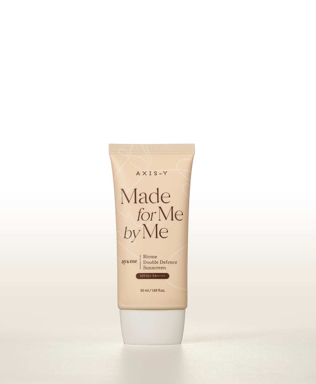 AXIS-Y Biome Double Defense Sonnenschutzcreme 50ml, helle Tube mit Verpackung, schützt vor Sonne und Umwelt.