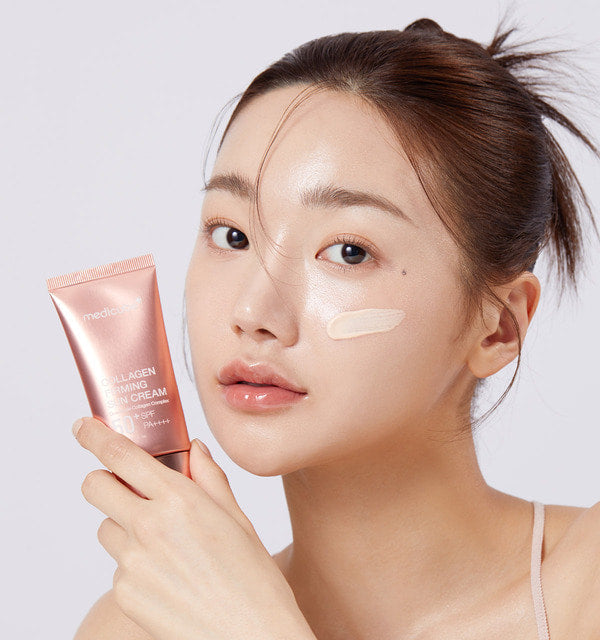 medicube Kollagen Straffende Sonnencreme mit Glow-Effekt, 50 ml, cremige Textur, sichtbare Anwendung auf der Haut