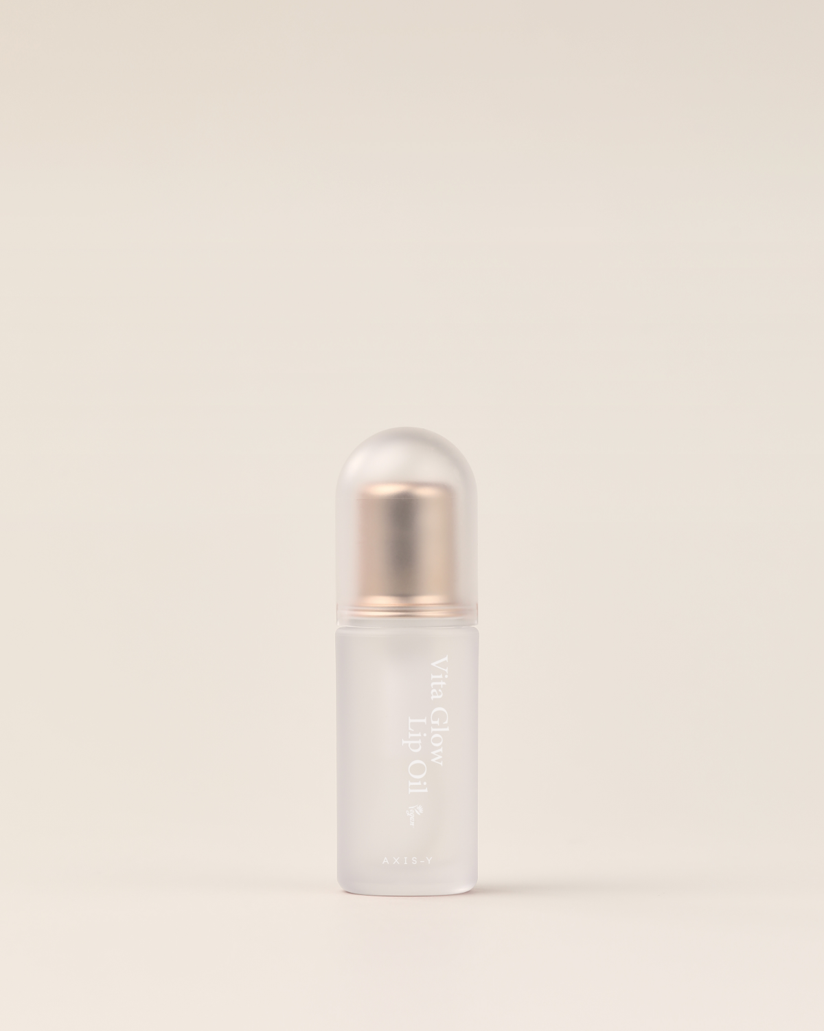 AXIS-Y Vita Glow Lip Oil in transparent Flasche, glänzender Lipgloss mit pflegender Formel, für einen natürlichen Glanz.