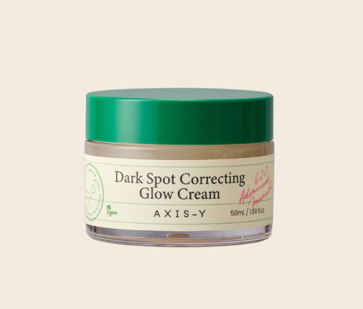 AXIS-Y Dark Spot Correcting Glow Cream in 50ml, cremige Textur und dunkle Flecken auf der Verpackung sichtbar