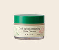 AXIS-Y Dark Spot Correcting Glow Cream in 50ml, cremige Textur, für einen strahlenden Teint, auf einem weißen Hintergrund.